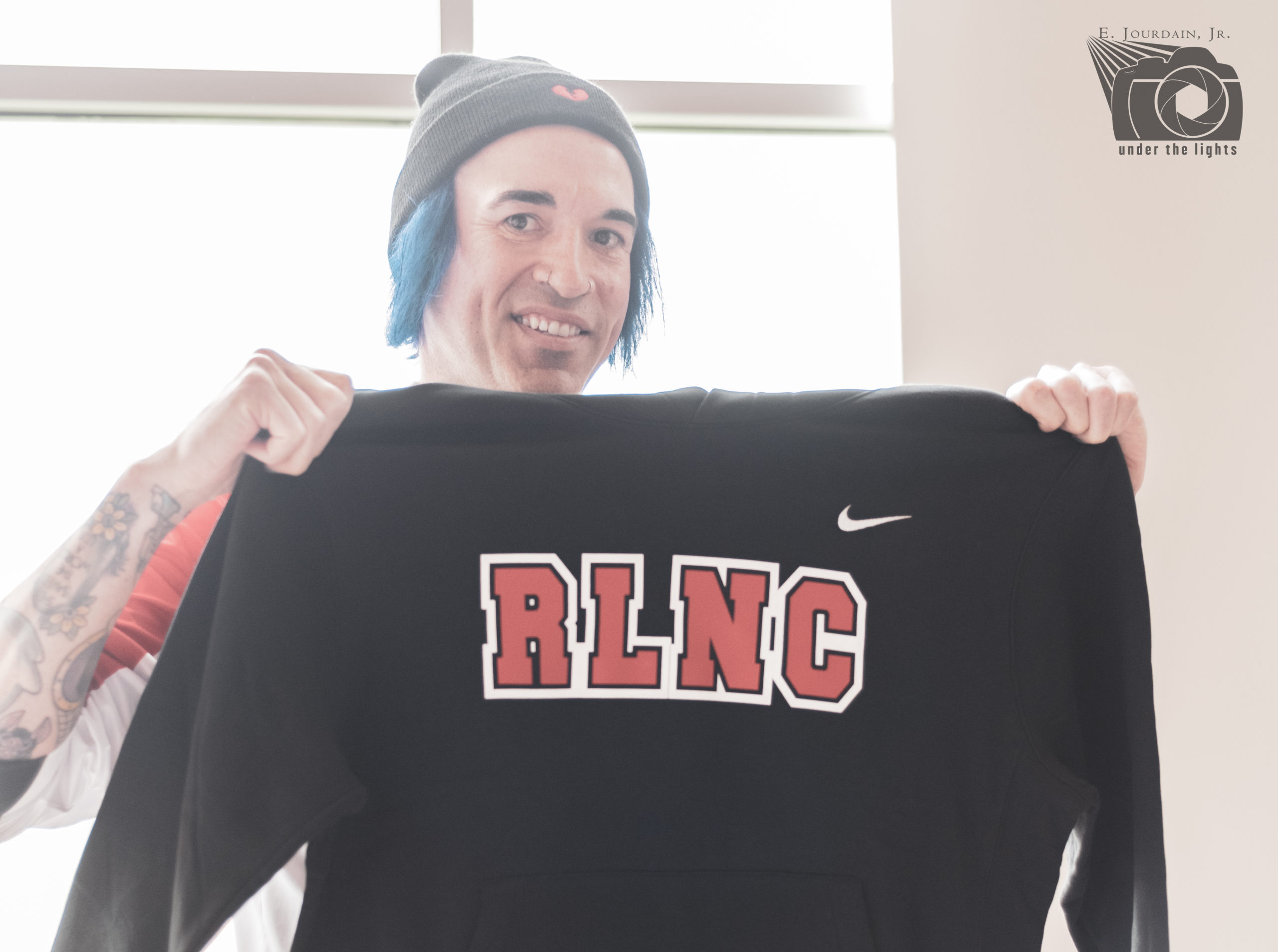 Author and Red Lake Nation Member Byron Graves displays his gifted a Red Lake Nation College hoodie 